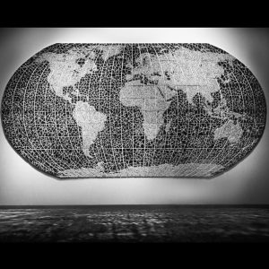 World map mosaic mirror sculpture in contrasting grid and web pattern on gallery wall