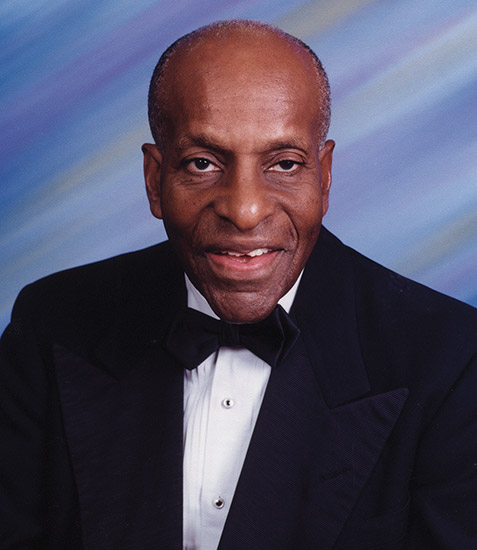 Old African-American man smiling in tuxedo