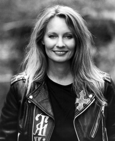white woman in black shirt and leather jacket