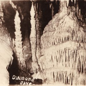 Cave interior with stalagmites signed "Diamond Cave"