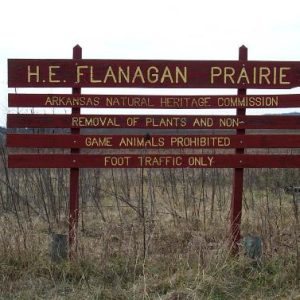 "H. E. Flanagan Prairie" sign in field