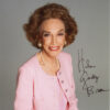 picture of white woman in pink suit with pearl necklace signed "Helen Gurley Brown"