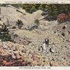 White man woman and girl standing in rock crater on post card