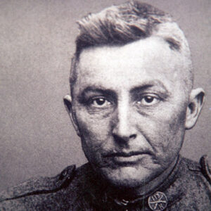 White man with close-cropped hair in military uniform