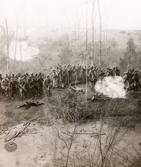 Group of soldiers with guns on battlefield with a few men fallen to the ground
