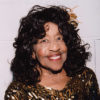 Older African-American woman smiling in dress