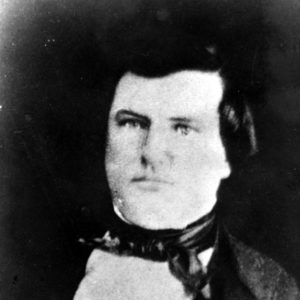 White man wearing a suit and bow tie