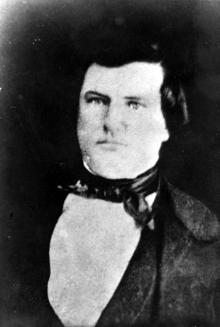 White man wearing a suit and bow tie