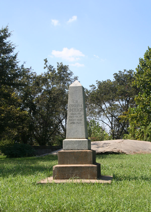"Colonel Charles A Lindbergh made his first flight here April 1923" stone obelisk on two-tiered base