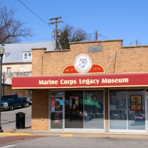 brick building with red awning " Marine Corps Legacy Museum"
