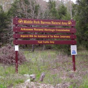 "Middle Fork Barrens Natural Area" sign in forested area