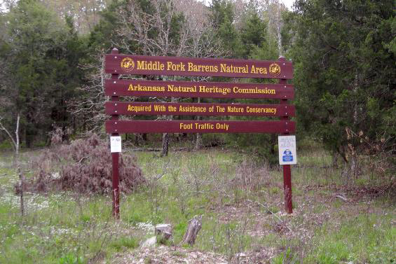 "Middle Fork Barrens Natural Area" sign in forested area