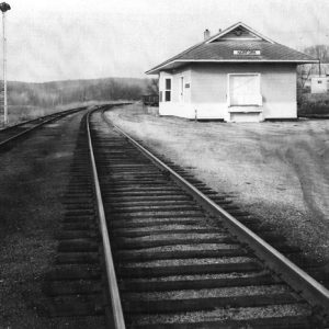 small depot building labeled "Norfork" next to two train tracks