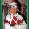 card with green and gold border featuring whtie man in jockey uniform "Perry Ouzts Journeyman"