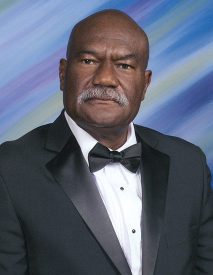 African-American man with mustache in tuxedo