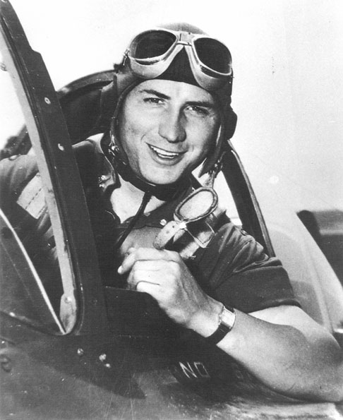 Young white man with goggles in an airplane