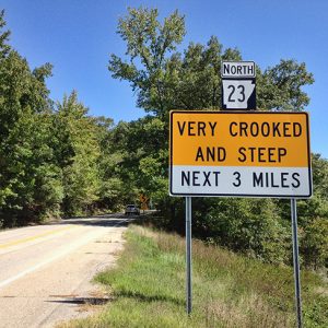 "Very crooked and steep" sign on Highway 23 North