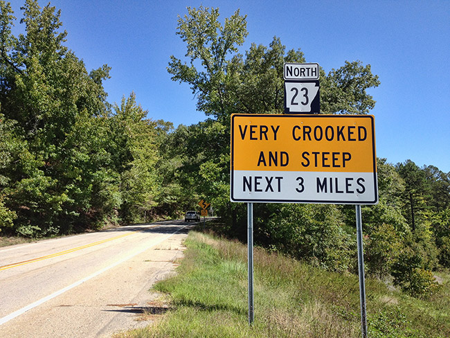 "Very crooked and steep" sign on Highway 23 North