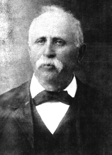 Portrait white man in suit and bow tie with mustache