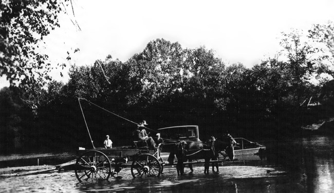 horse-drawn buggy operating via ropes and pullies a ferry with car