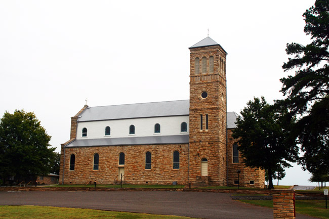 two-story brick church with bell tower