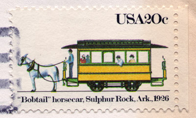 "USA 20" cent postage stamp with drawing of streetcar labeled "'Bobtail' horsecar, Sulphur Rock, Ark., 1926"