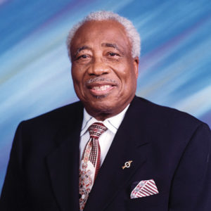 Older African-American man smiling in suit and tie