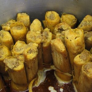 tamales upright steaming in a pot