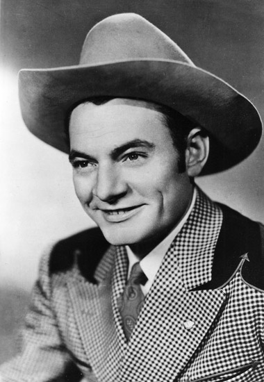 white man in cowboy hat and checkered suit