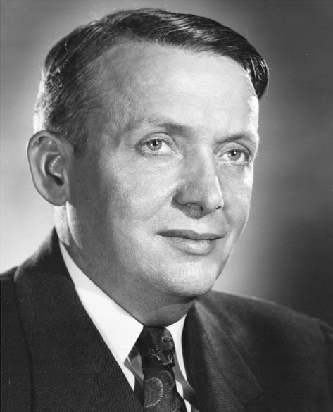 White man in suit with floral tie
