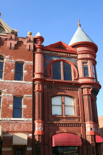 three-story Victorian style building with words at top reading "Crawford County Bank"