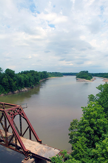 River as seen from above steel truss bridge