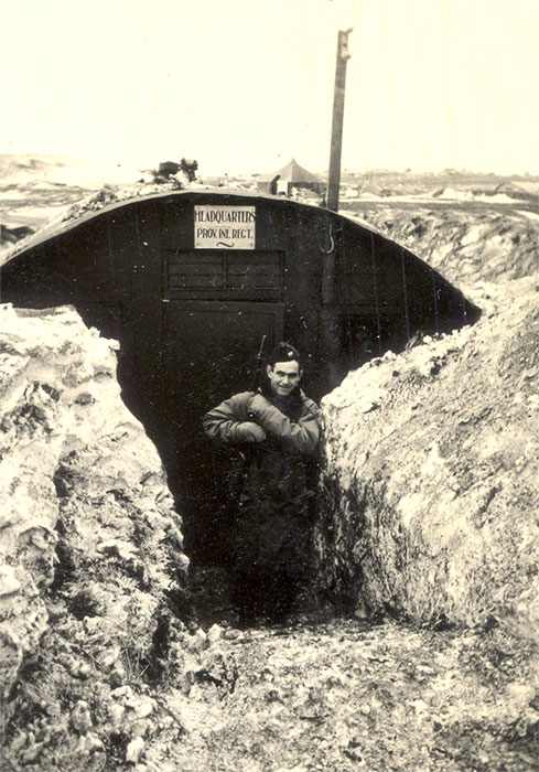 White soldier outside "headquarters" bunker buried in snow