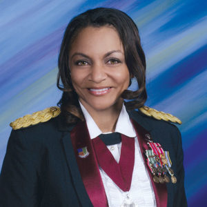 African-American woman smiling in military uniform with medals