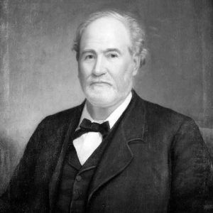 Portrait painting of solemn older white man with short curly hair and a trimmed beard wearing a suit and bow tie