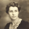 White woman with short hair in formal pose