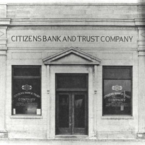 Front of granite building with "Citizens Bank and Trust Company" engraved on it