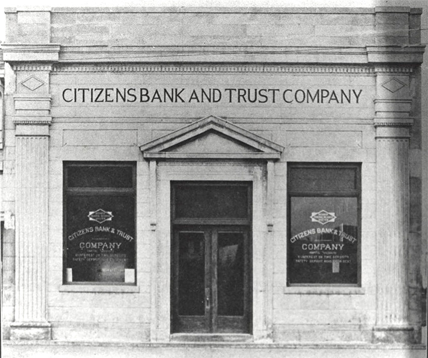 Front of granite building with "Citizens Bank and Trust Company" engraved on it