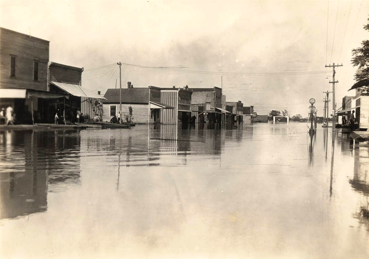 Storefront buildings with street filled with water