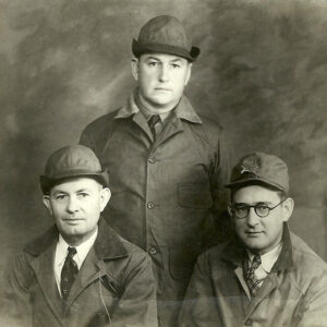 Portrait of three white man in hunting caps