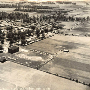 Aerial view of tents amid field near small town