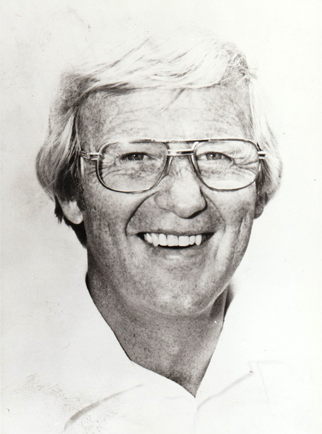 Portrait of white man with glasses in white shirt