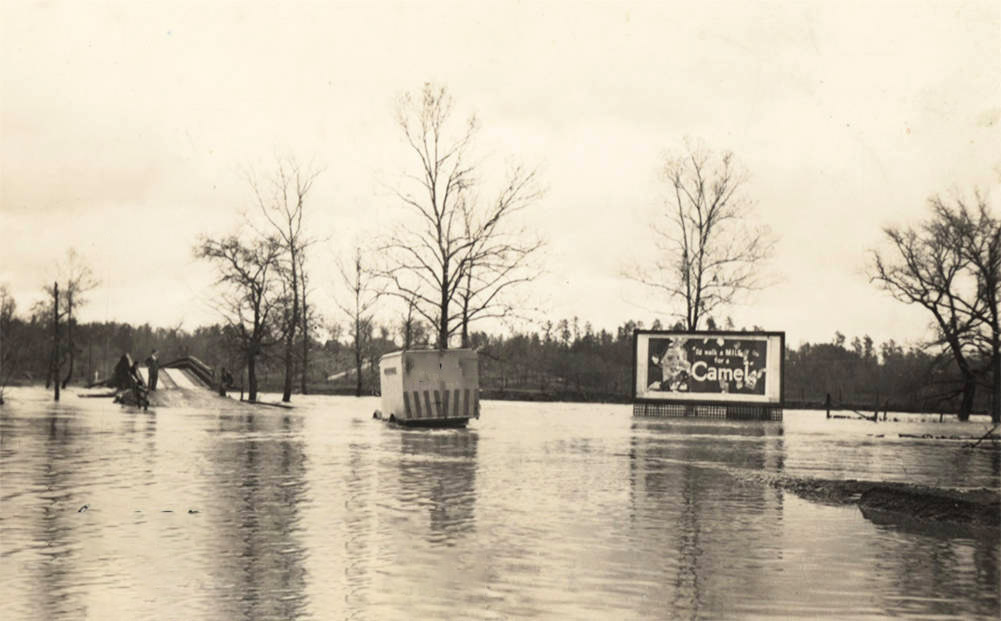 Highway and road signs submerged by flood waters