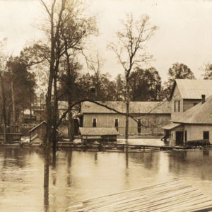 House and buildings partially submerged in flood waters