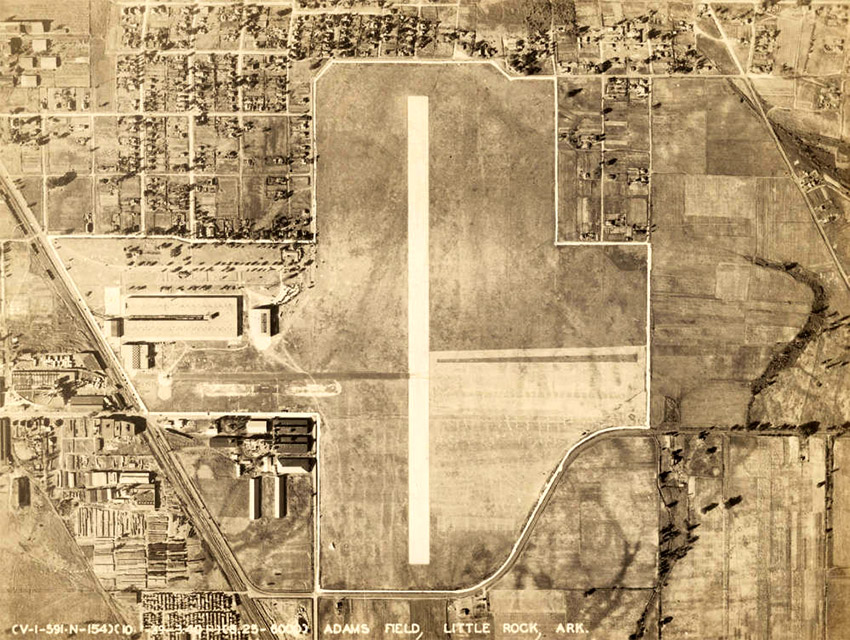 View of airport runway and neighborhoods from the air