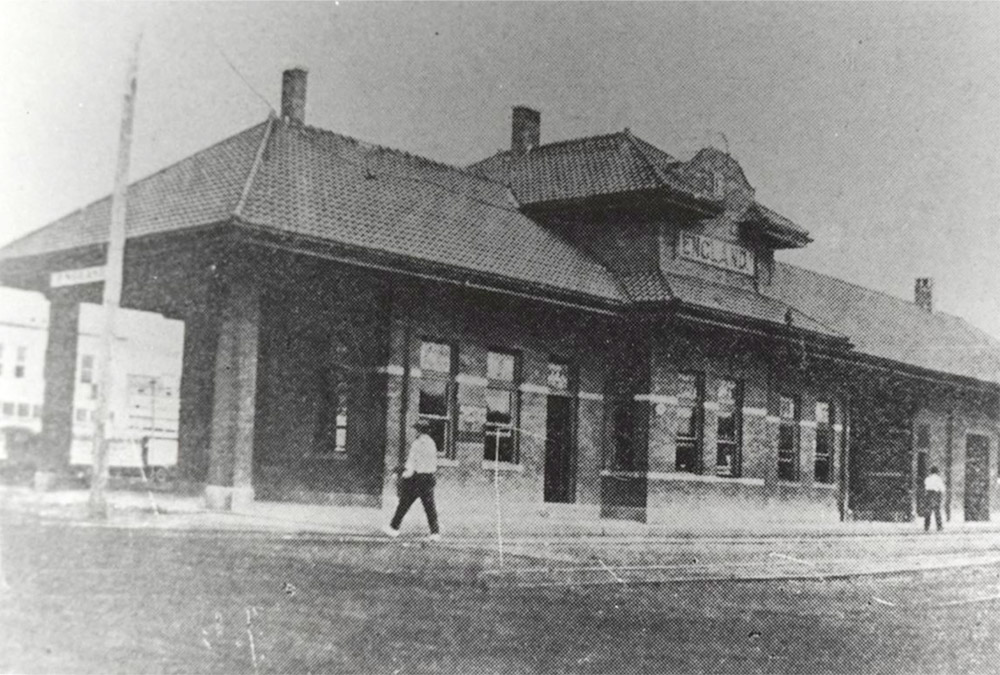 Single story building with man walking in foreground