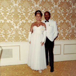 African American man and woman in white wedding attire