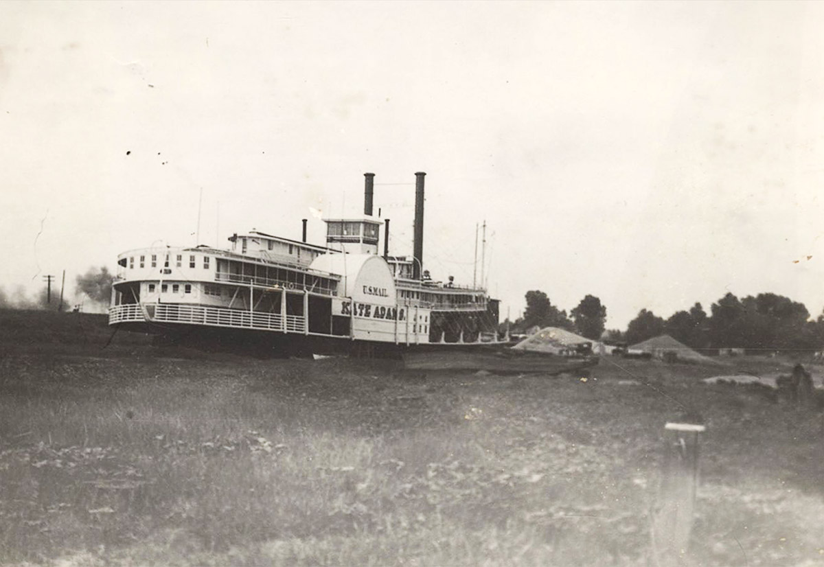 Steamboat "Kate Adams" on river with "U.S. Mail" painted on the side