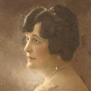 Painting of white woman in profile wearing pearl jewelry
