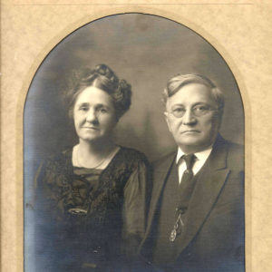 Older white woman and white man in formal sitting
